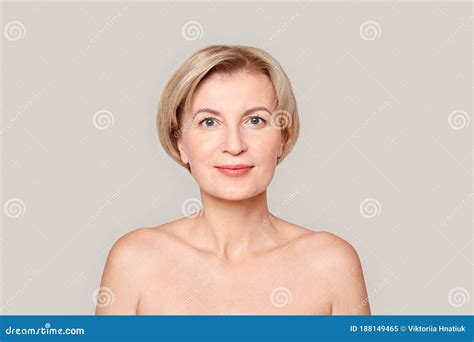 Beauty Conept Mature Woman Standing Isolated On Grey Close Up Smiling