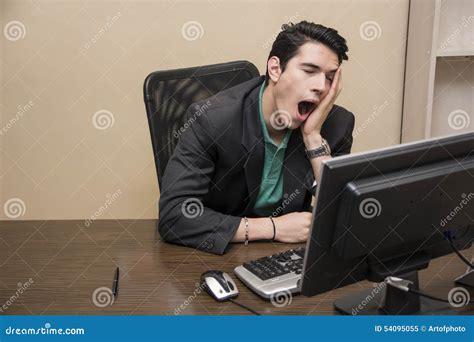 tired bored young businessman sitting  office stock photo image