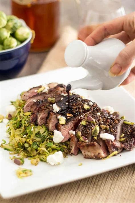 crusted strip steak over warm shaved brussels sprouts