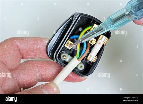 man wiring english  pin  amp plug inserting neutral wire england uk western europe stock