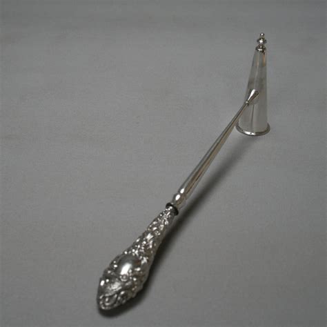 medium sized candle snuffer  silver handle williams antiques