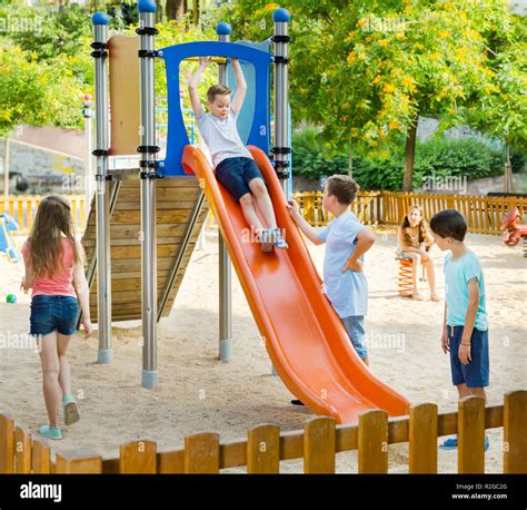 kids playing      playground stock photo alamy