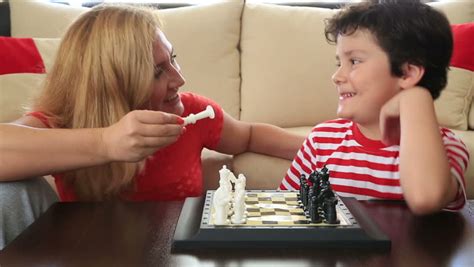 mother teaches son how to play chess stock footage video 6478706 shutterstock