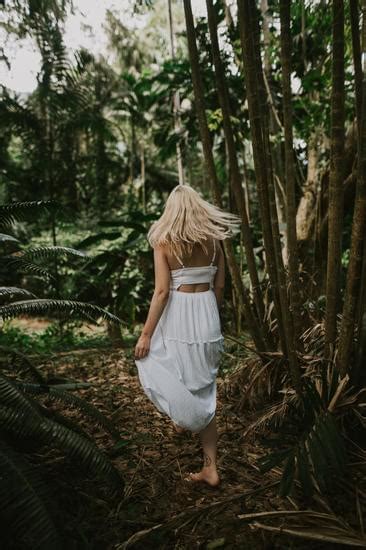 Blonde Woman Walking Barefoot Through Jungle Photos By Canva