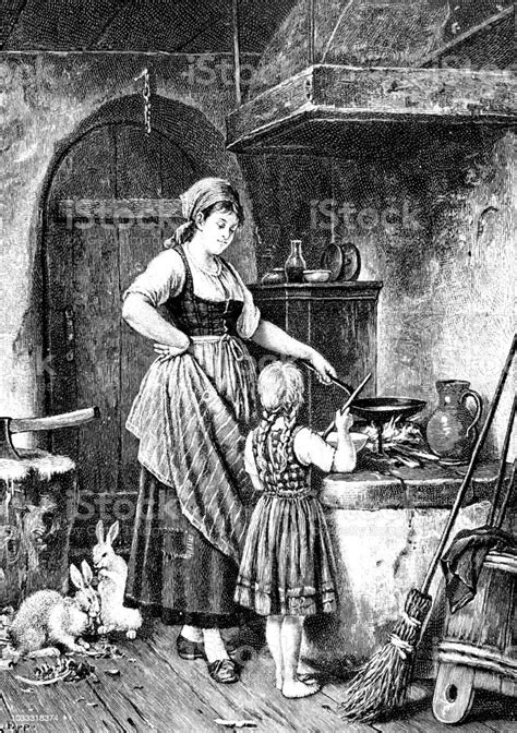 cooking lessons mother teaches her daughter how to cook stock