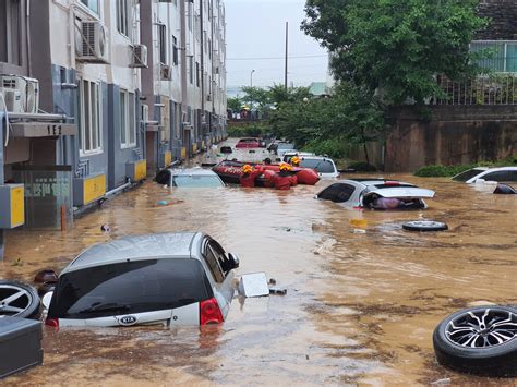 thousands evacuate   korea  heavy rains trigger flood landslides
