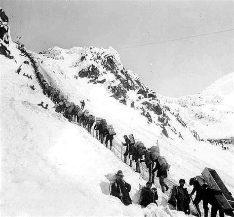 amazing photographs  prospectors carrying supplies ascending  chilkoot pass