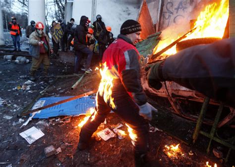 a pro european integration protester catches fire during clashes with police in kiev on monday