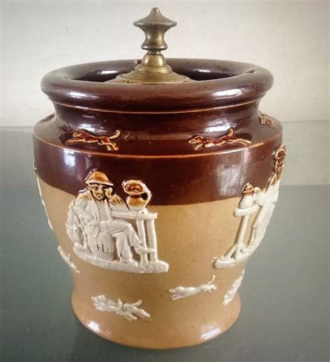 antique decorated royal doulton tobacco jar  screw  lid