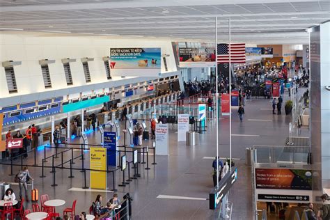 logan airport renovations  reroutings tackle congestion  passenger growth curbed boston