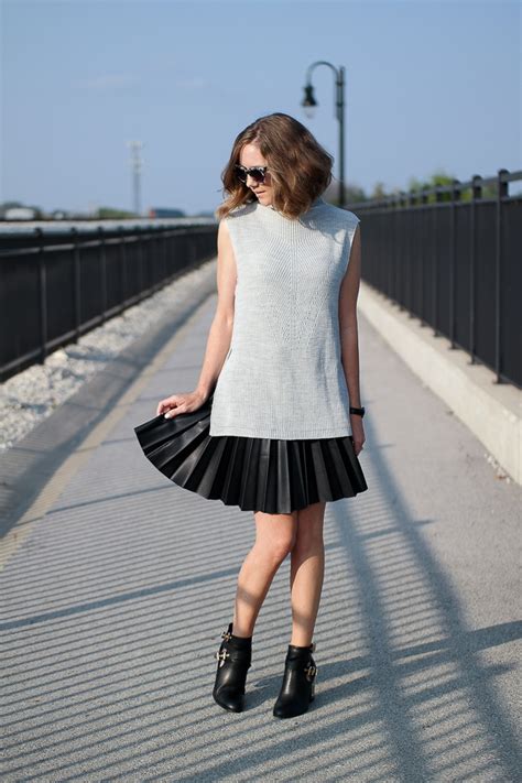 fall style a sleeveless sweater and a pleated leather