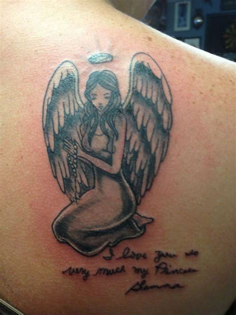 A Woman With An Angel Tattoo On Her Back