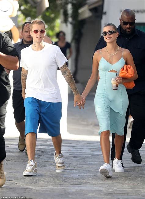 justin bieber lovingly holds hands with his stunning wife hailey bieber