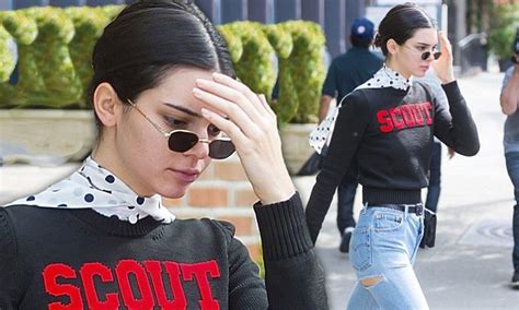 kendall jenner flashes her legs in denim shorts sneakers daily mail