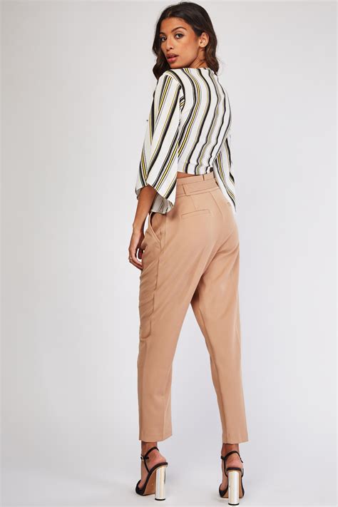 belted beige tapered trousers