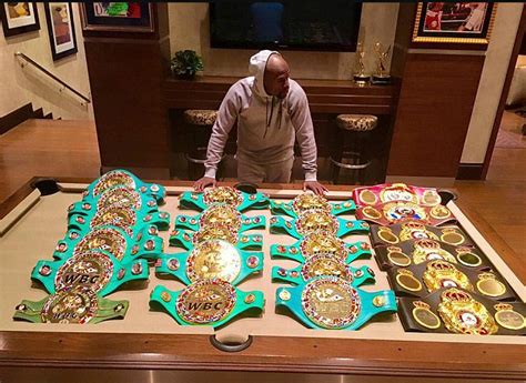 Floyd Mayweather Shows Off World Championship Belts As Conor Mcgregor