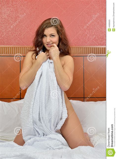 caucasian woman in bed covered by sheet stock image image of model