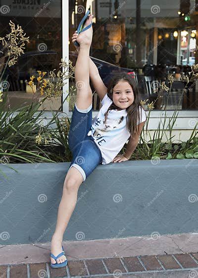 Lovely Girl Holding Leg Extended To The Sky Stock Image Image Of
