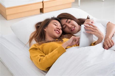 Asia Lesbian Lgbt Couple Lay On Bed And Nose Kiss With Happiness Stock