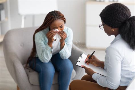 depressed black woman lying  couch  psychologist office stock image image  office notes