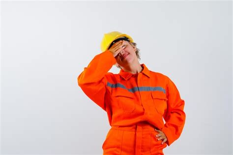 free photo firewoman in her uniform with a safety helmet