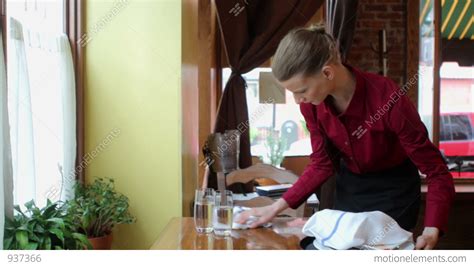 waitress clearing table in restaurant stock video footage