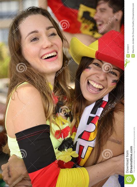 happy german women sport soccer fans celebrating victory