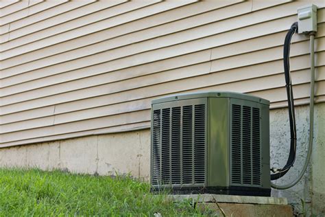 residential central air conditioning unit sitting   home   regulating  homes
