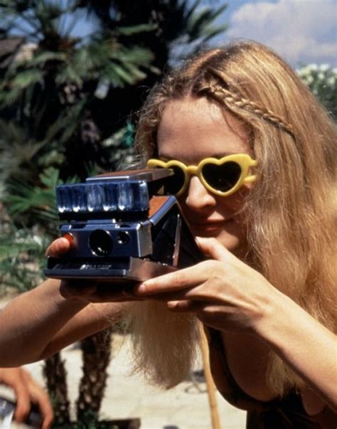 girl with heart sunglasses toting a polaroid camera those sunglasses are awesome 映画