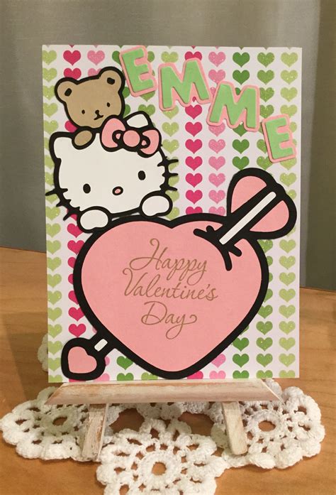 kitty valentines day card sitting  top   table