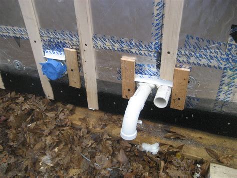 duct pipe penetration with metal cap flashing and wood blocking for trim attachment building