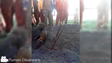 thief buried alive after digging his own grave video south africa