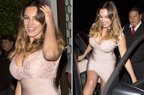 kelly brook exposes extreme cleavage as she emerges post