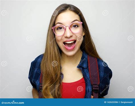 excited female college university student isolated  white background surprised young student