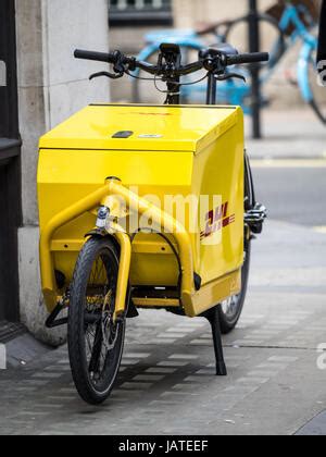 dhl bicycle delivery transport   city centre  bordeaux france stock photo alamy