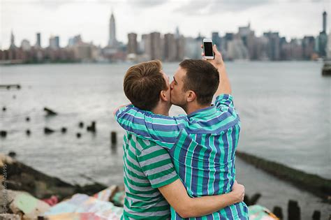 Gay Couple Taking A Selfie Against Manhattan Skyline By Gic Couple