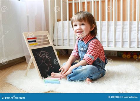 years toddler draws   blackboard  chalk stock image image