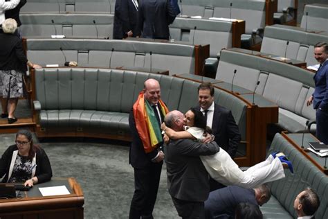 australian lawmakers from opposing parties hug joyously after same sex marriage vote huffpost