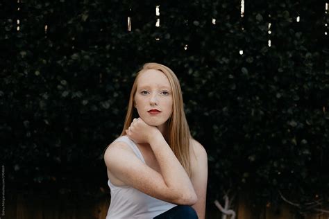simple portrait of beautiful redhead teen by stocksy contributor