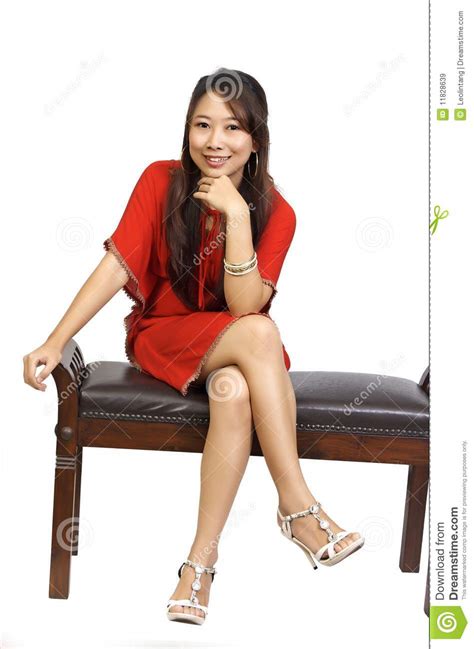 Woman Sitting On Chair Wearing Red Dress Royalty Free