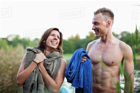 cheerful couple  towel  beach stock photo dissolve