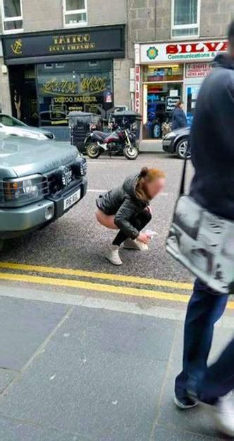 Woman Caught Urinating On Busy Street In Broad Daylight