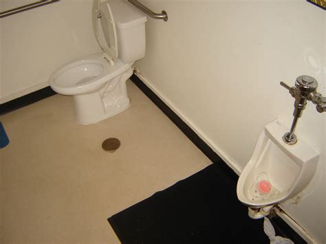 wrong gents restrooms with a urinal and a toilet in the same room