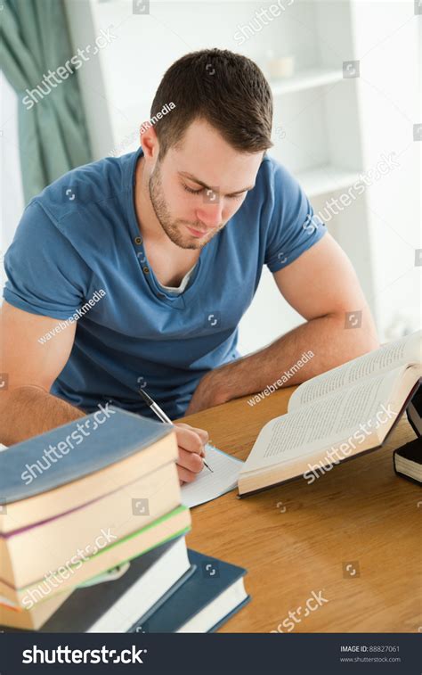male student working hard   book report royalty  stock photo