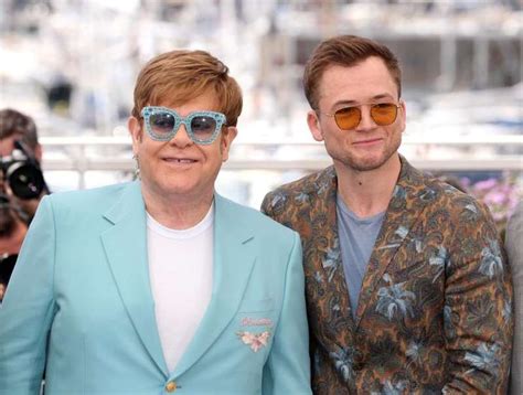 elton john and taron egerton attends the photocall for