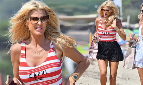 victoria silvstedt 46 puts on a leggy display in black lace shorts