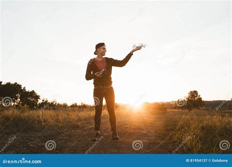 young man standing  drone outdoor sunset stock image image  flight entertainment