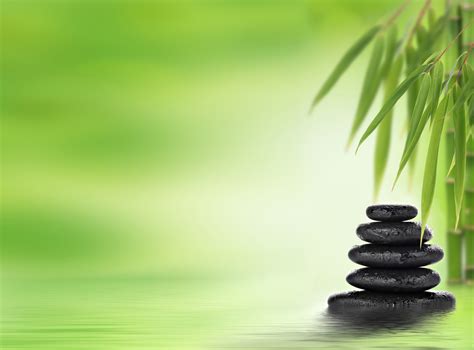 Spa Background With Stacked Massage Stones And Bamboo Ambrosia Massage