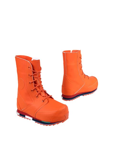 lyst raf simons lace  rubber mid calf boots  orange  men
