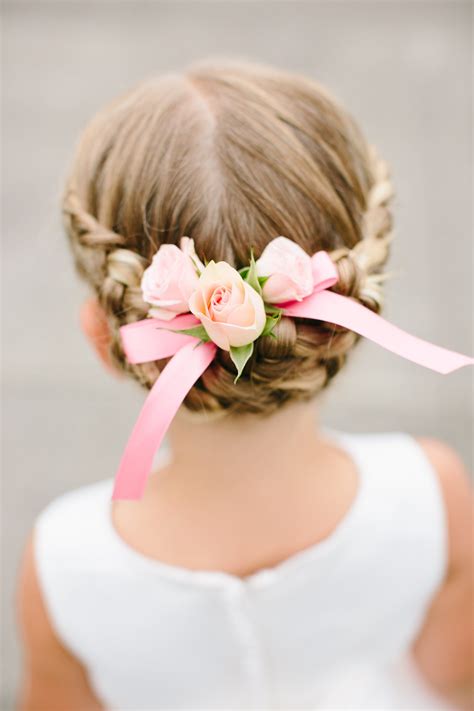 braided flower girl updo with floral accent flower girl updo cute